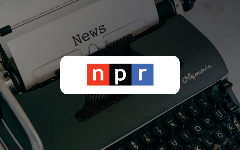 Typewriter that says "News". NPR logo is showing in front of the typewriter.